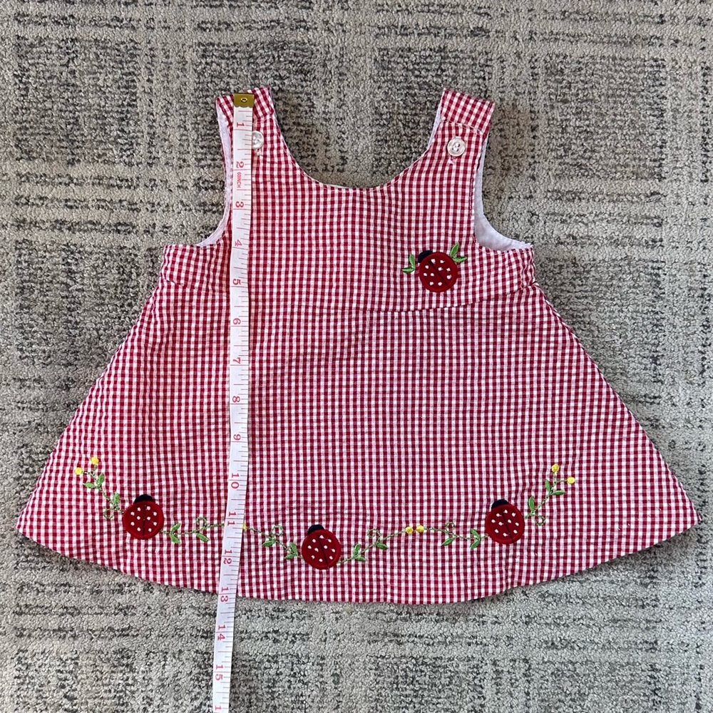 Red and White Striped Fabric Accessory with Decorative Pattern